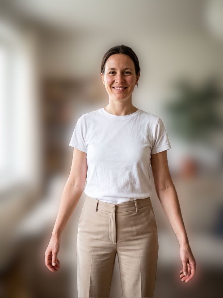 The same woman in sharp focus in front of her blurred living room